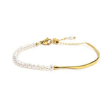 Bracciale semi rigido con tubolare twisted e catena con perle oro - 1